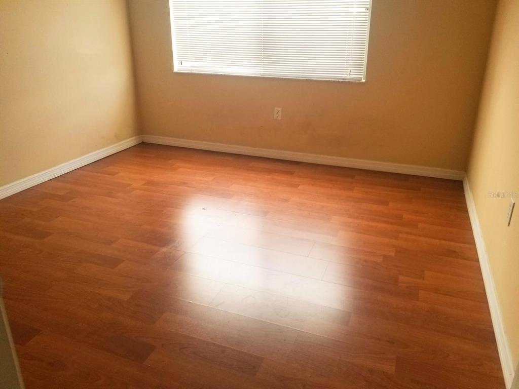 5859 Curry Ford Road, Unit 130 Orlando, FL 32822 - Photo 5 of 7 an empty room with a window