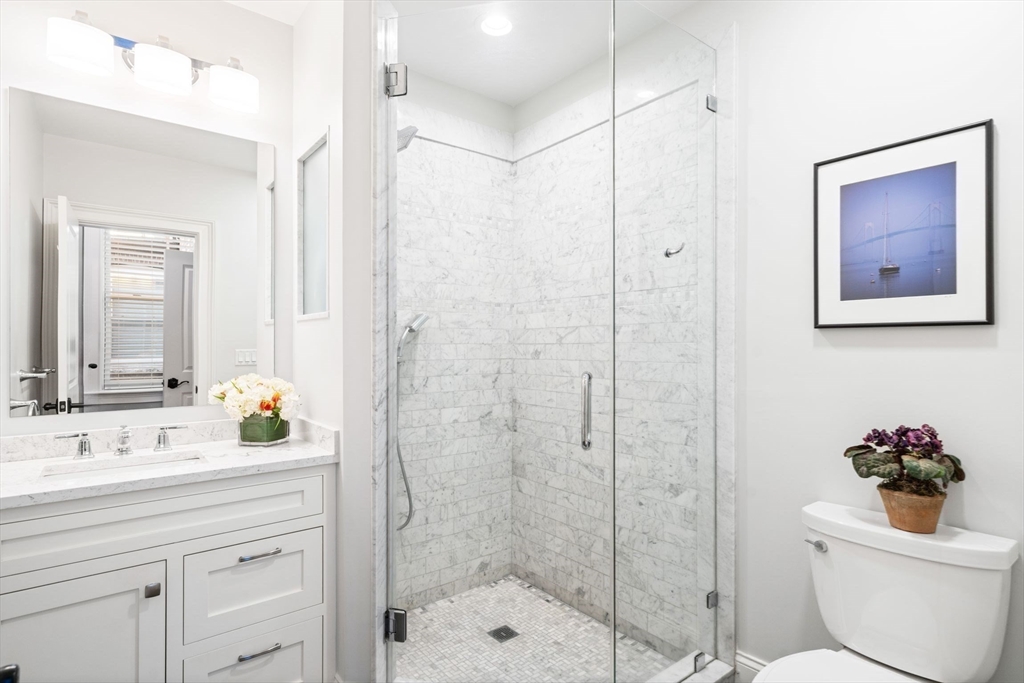 33 Monument Square, Unit 1 Boston, MA 02129 - Photo 13 of 19 a bathroom with a sink a toilet and shower