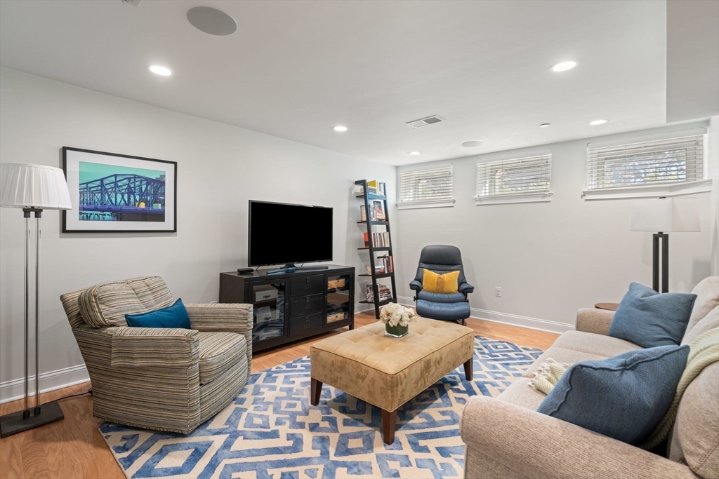 33 Monument Square, Unit 1 Boston, MA 02129 - Photo 14 of 19 a living room with furniture and a flat screen tv