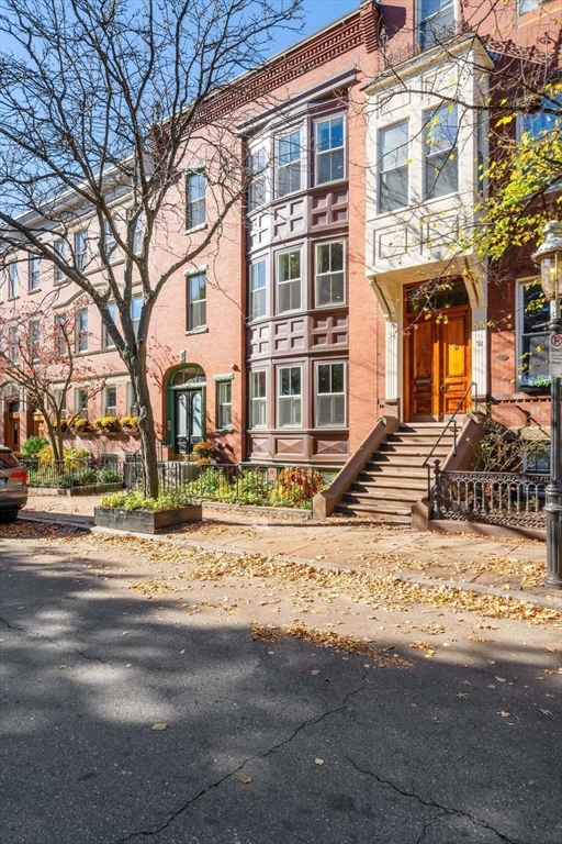 33 Monument Square, Unit 1 Boston, MA 02129 - Photo 18 of 19 a front view of a house with a yard