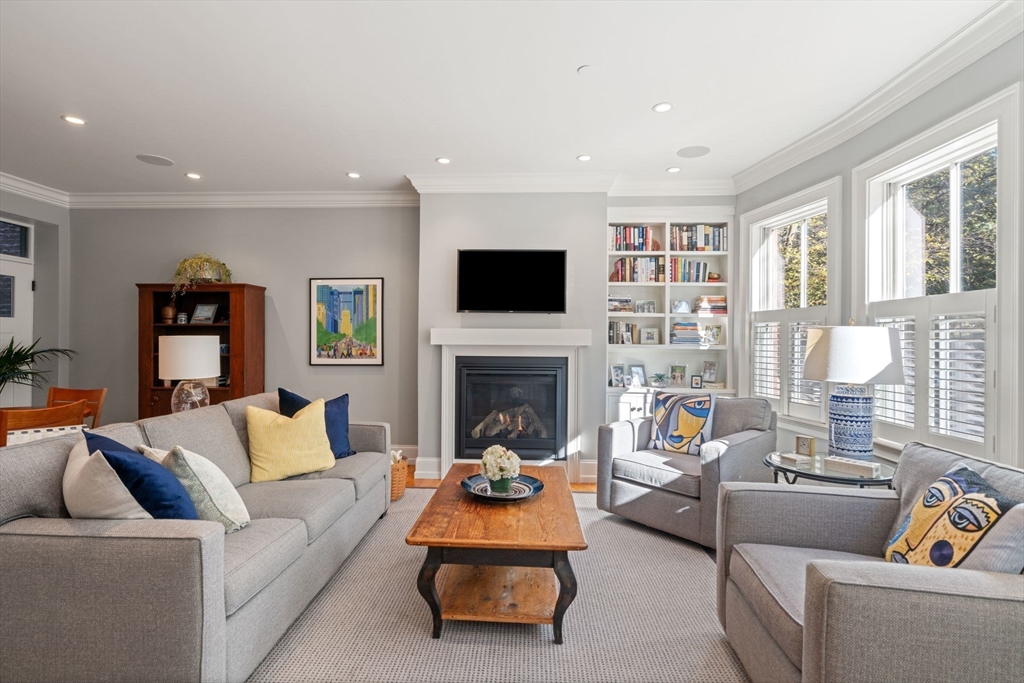 33 Monument Square, Unit 1 Boston, MA 02129 - Photo 3 of 19 a living room with furniture and a fireplace
