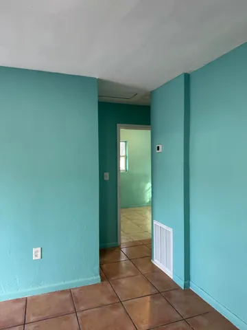 a view of a elevator and an empty room