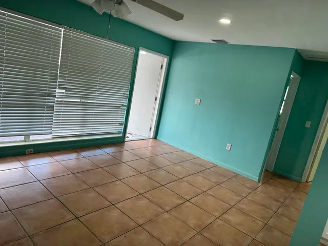 a kitchen with a refrigerator and a stove