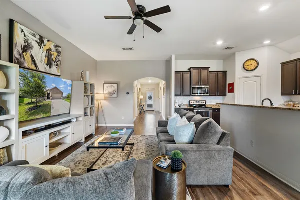 a living room with furniture and a flat screen tv