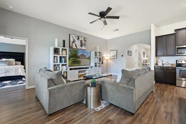a living room with furniture and a flat screen tv