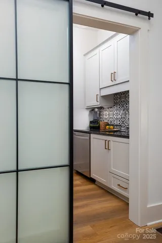 a white refrigerator freezer and a stove sitting inside of a kitchen