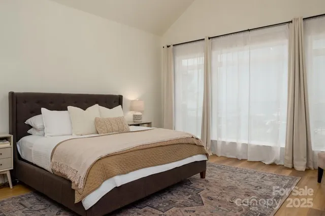 a bathroom with double sink and three mirror