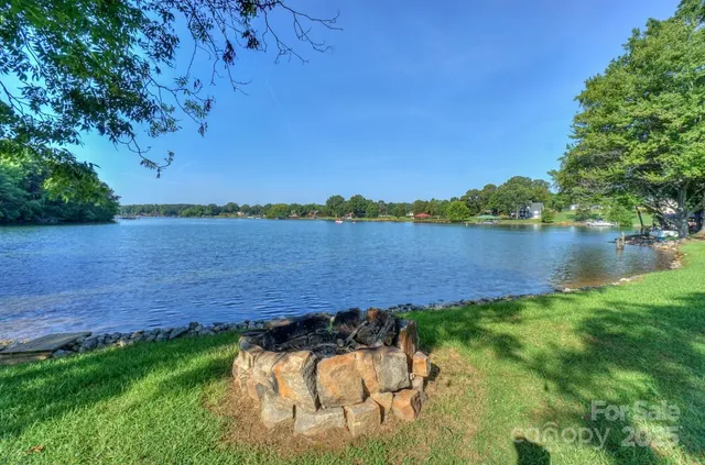an aerial view of a house with a lake view
