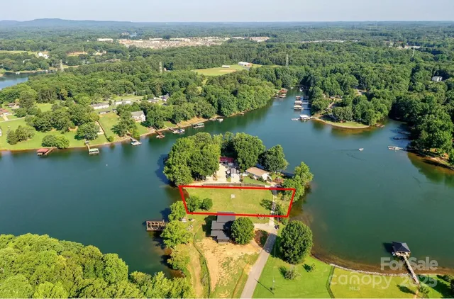 a front view of a house with a garden and yard