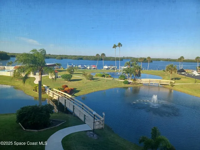 a view of a lake with a yard