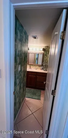 a bathroom with a mirror and a shower