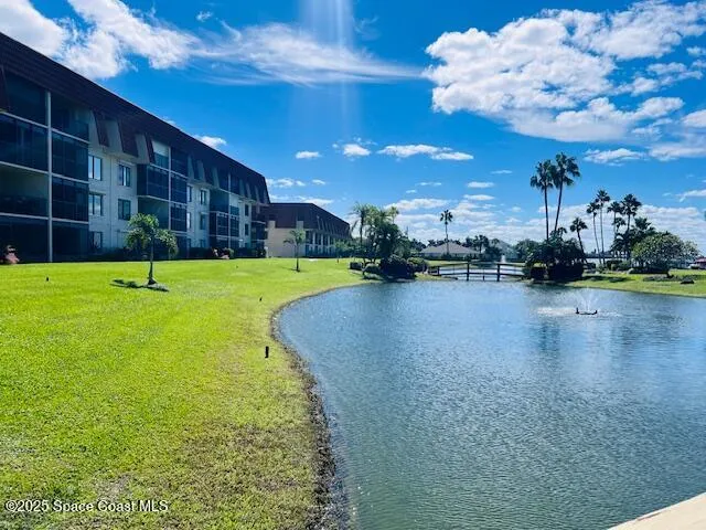 a view of a water with a building in the background