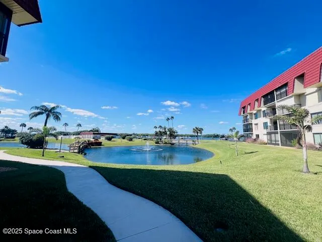 a view of a building and front yard