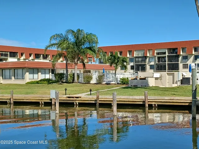 a small pool with table and chairs