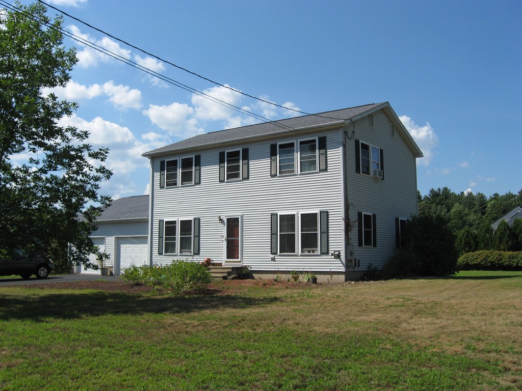 130 Plumtree Road Sunderland, MA 01375 - Photo 1 of 19 a front view of a house with a garden