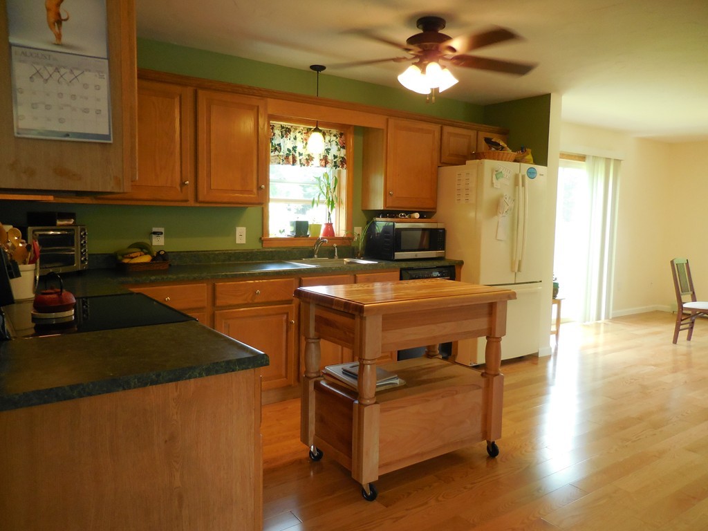 130 Plumtree Road Sunderland, MA 01375 - Photo 12 of 19 a kitchen with stainless steel appliances a stove a sink and a refrigerator
