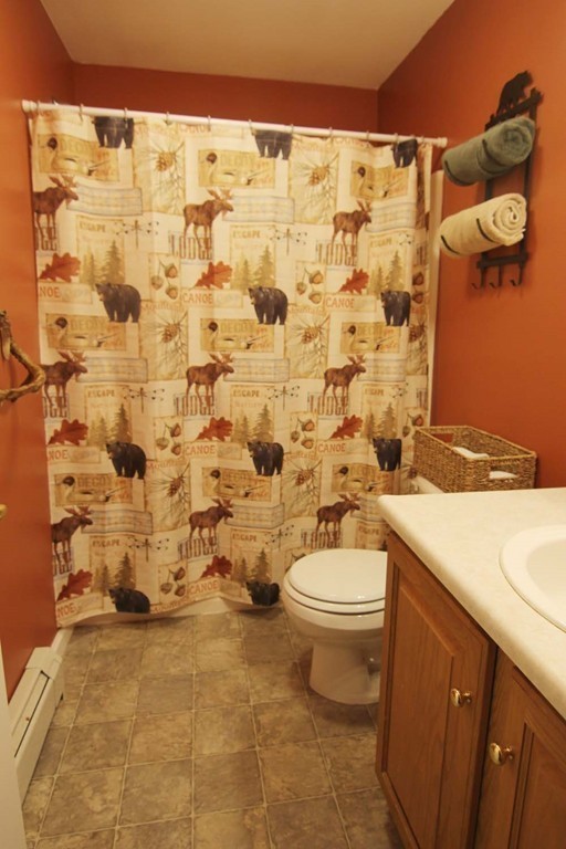 130 Plumtree Road Sunderland, MA 01375 - Photo 16 of 19 a bathroom with a granite countertop toilet a sink and a shower