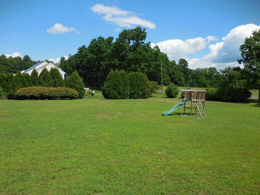 130 Plumtree Road Sunderland, MA 01375 - Photo 17 of 19 a view of a garden with a bench