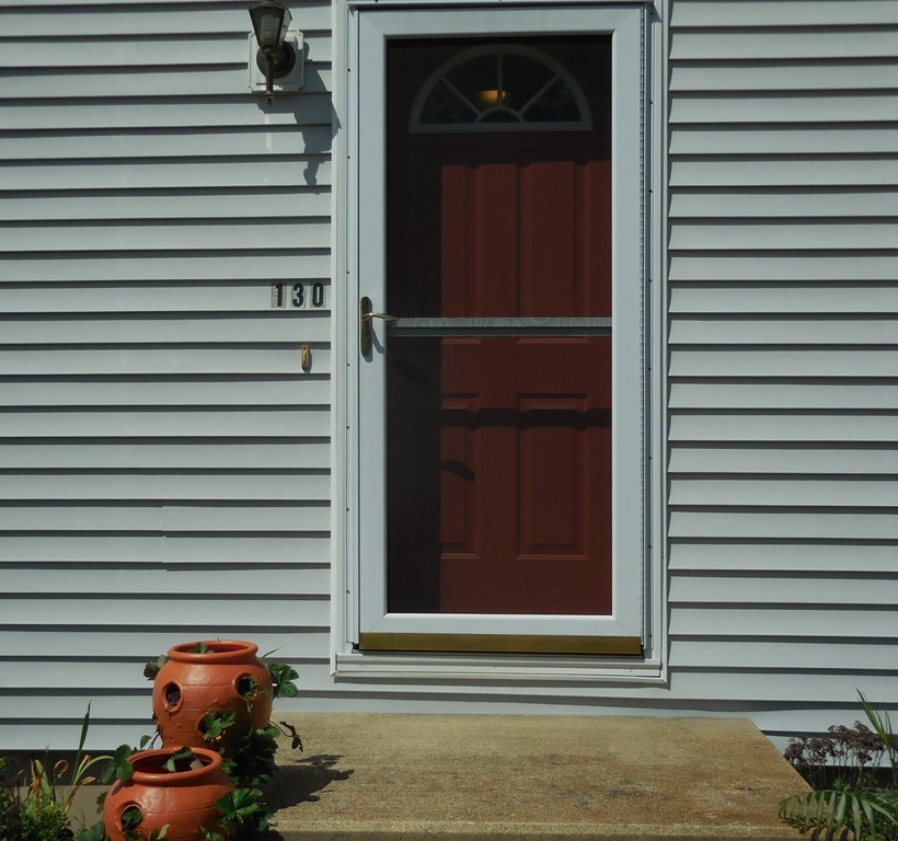 130 Plumtree Road Sunderland, MA 01375 - Photo 18 of 19 a view of a house with a door and a window