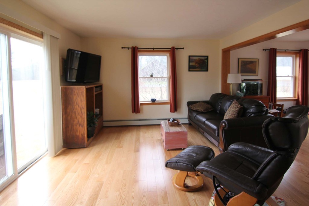 130 Plumtree Road Sunderland, MA 01375 - Photo 2 of 19 a living room with furniture and a flat screen tv
