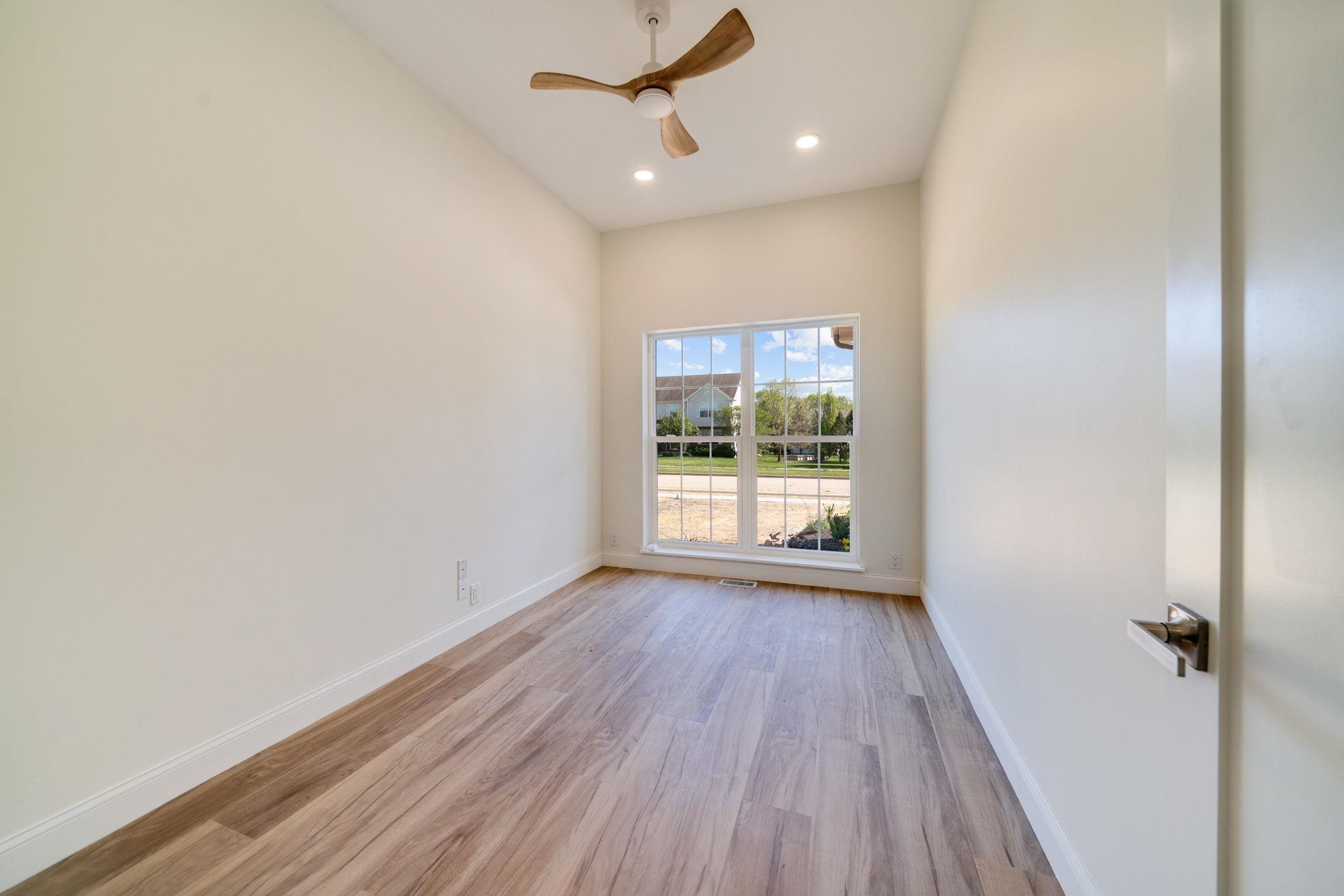 5145 Sycamore Ridge Road Belvidere, IL 61008 - Photo 27 of 57 wooden floor in an empty room with a window