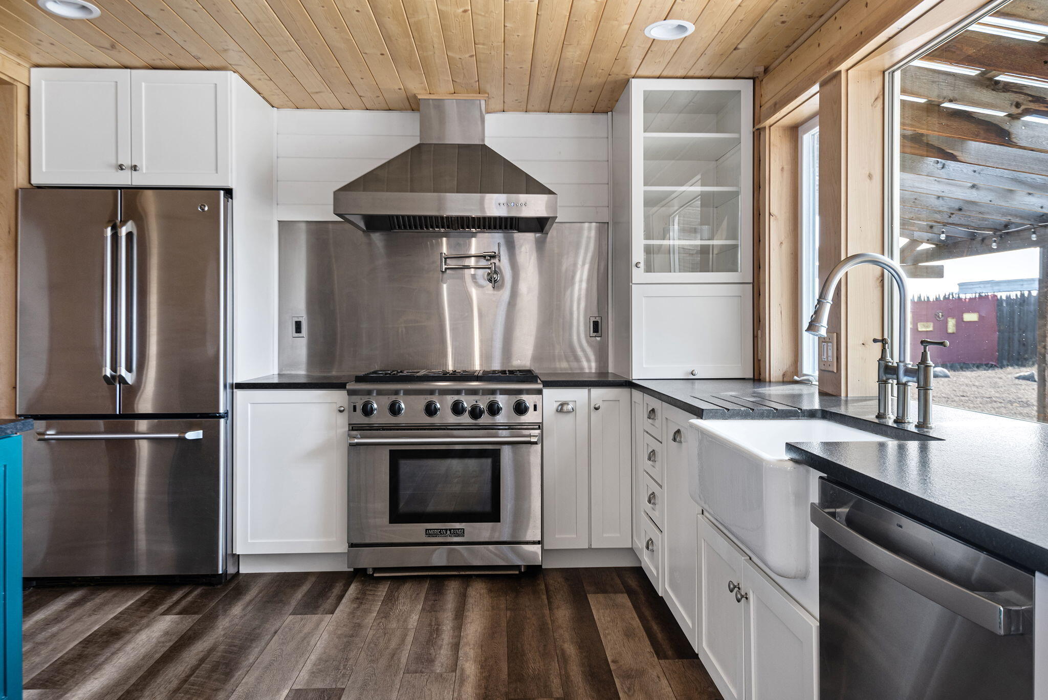 66901 Lance Road Bend, OR 97703 - Photo 21 of 71 a kitchen with a sink stove and refrigerator