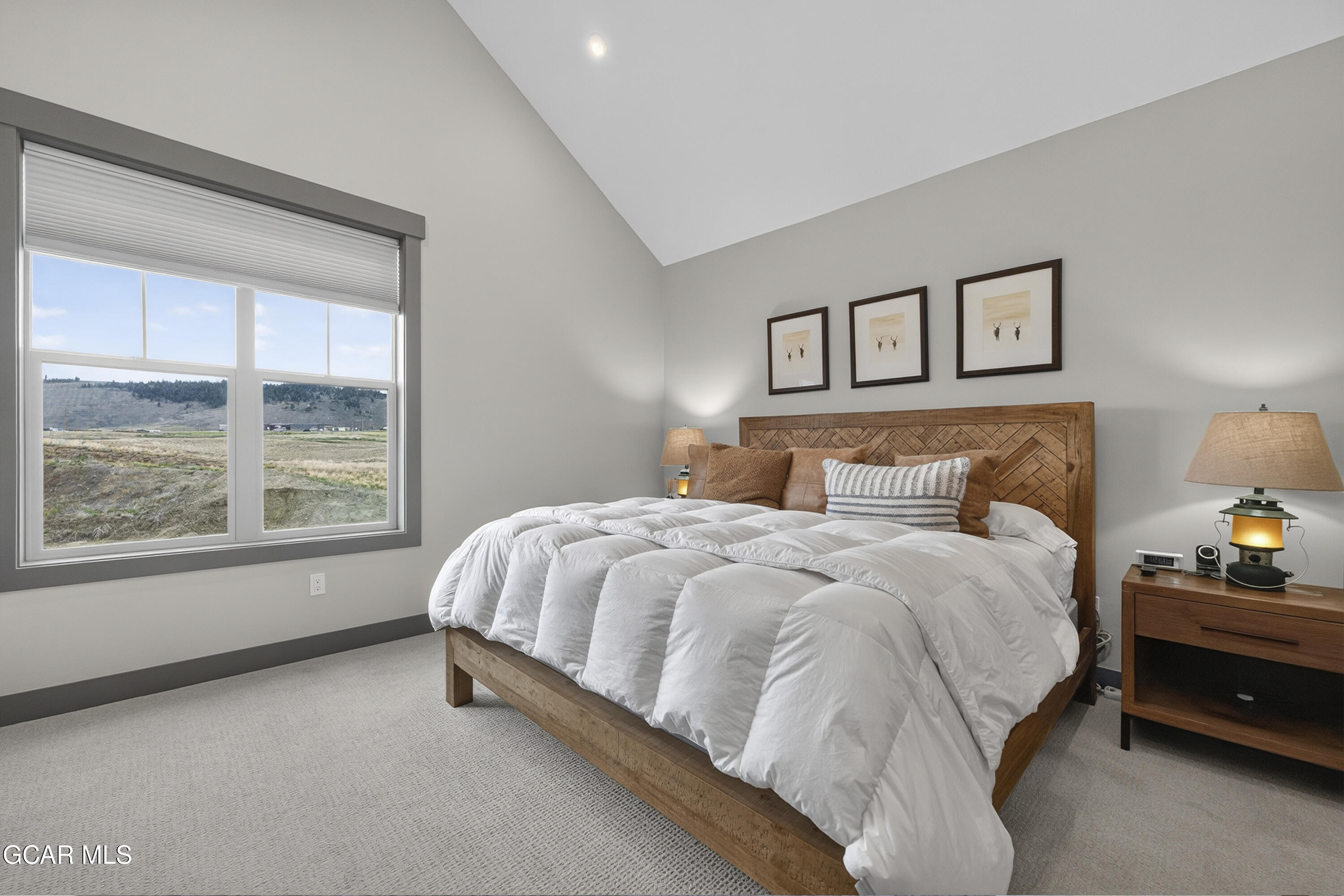 154 Eagle Ridge Drive Granby, CO 80446 - Photo 29 of 59 a large bed sitting in a bedroom next to a window
