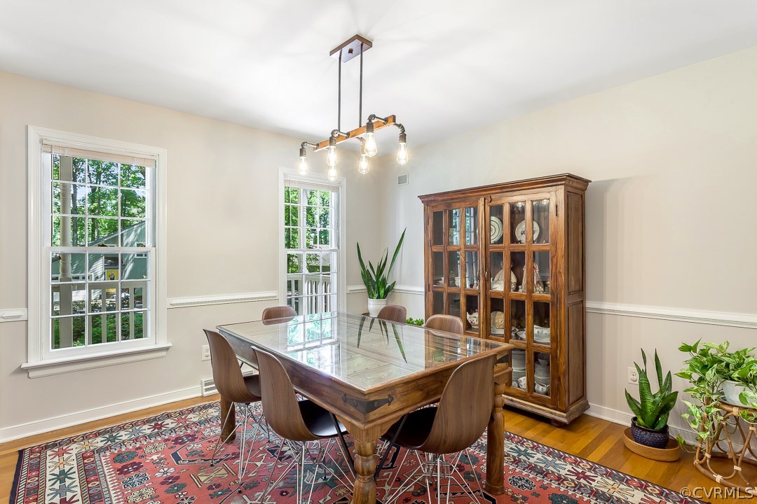 13815 Sterlings Bridge Road Midlothian, VA 23112 - Photo 13 of 27 a view of a dining room with furniture window and wooden floor