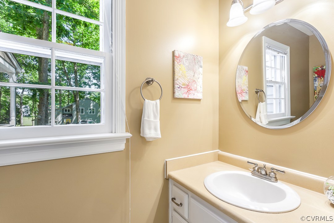 13815 Sterlings Bridge Road Midlothian, VA 23112 - Photo 14 of 27 a bathroom with a sink and a mirror