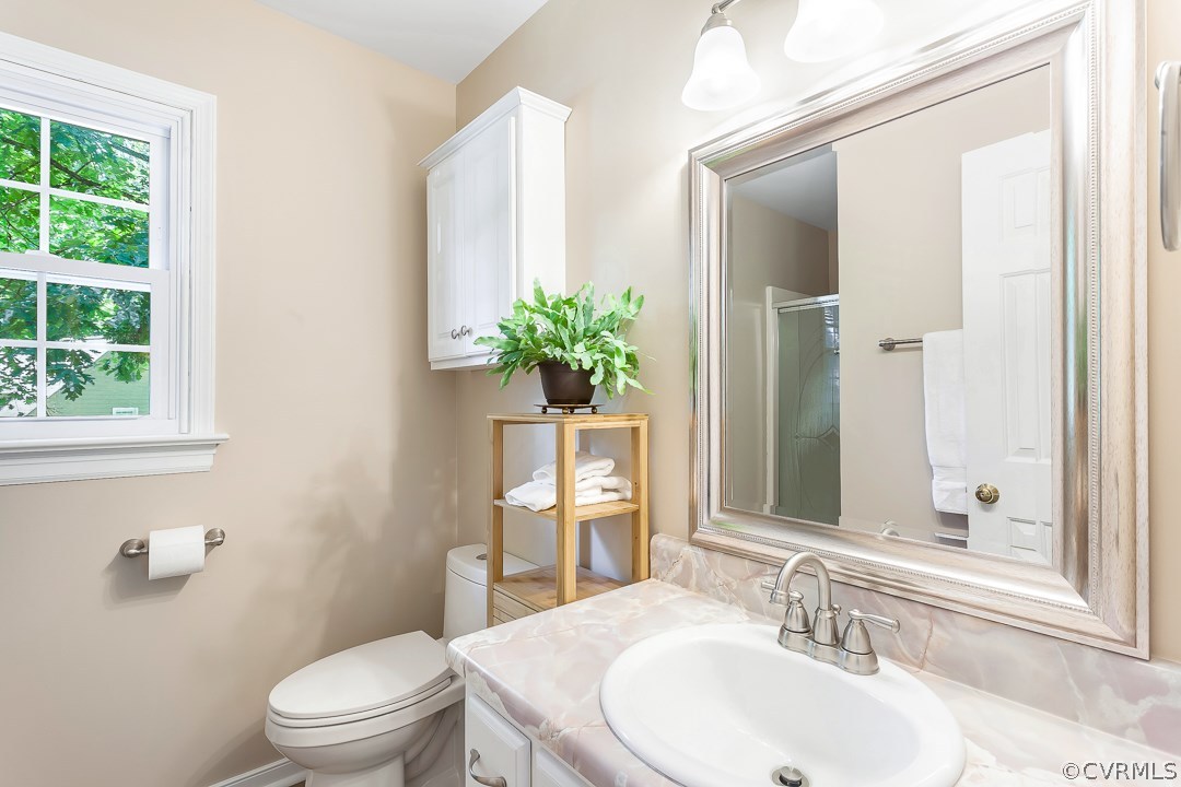 13815 Sterlings Bridge Road Midlothian, VA 23112 - Photo 18 of 27 a bathroom with a sink toilet and shower