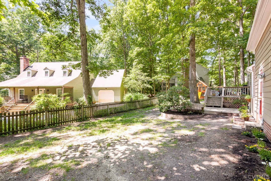 13815 Sterlings Bridge Road Midlothian, VA 23112 - Photo 24 of 27 a view of a yard with large trees and a small yard