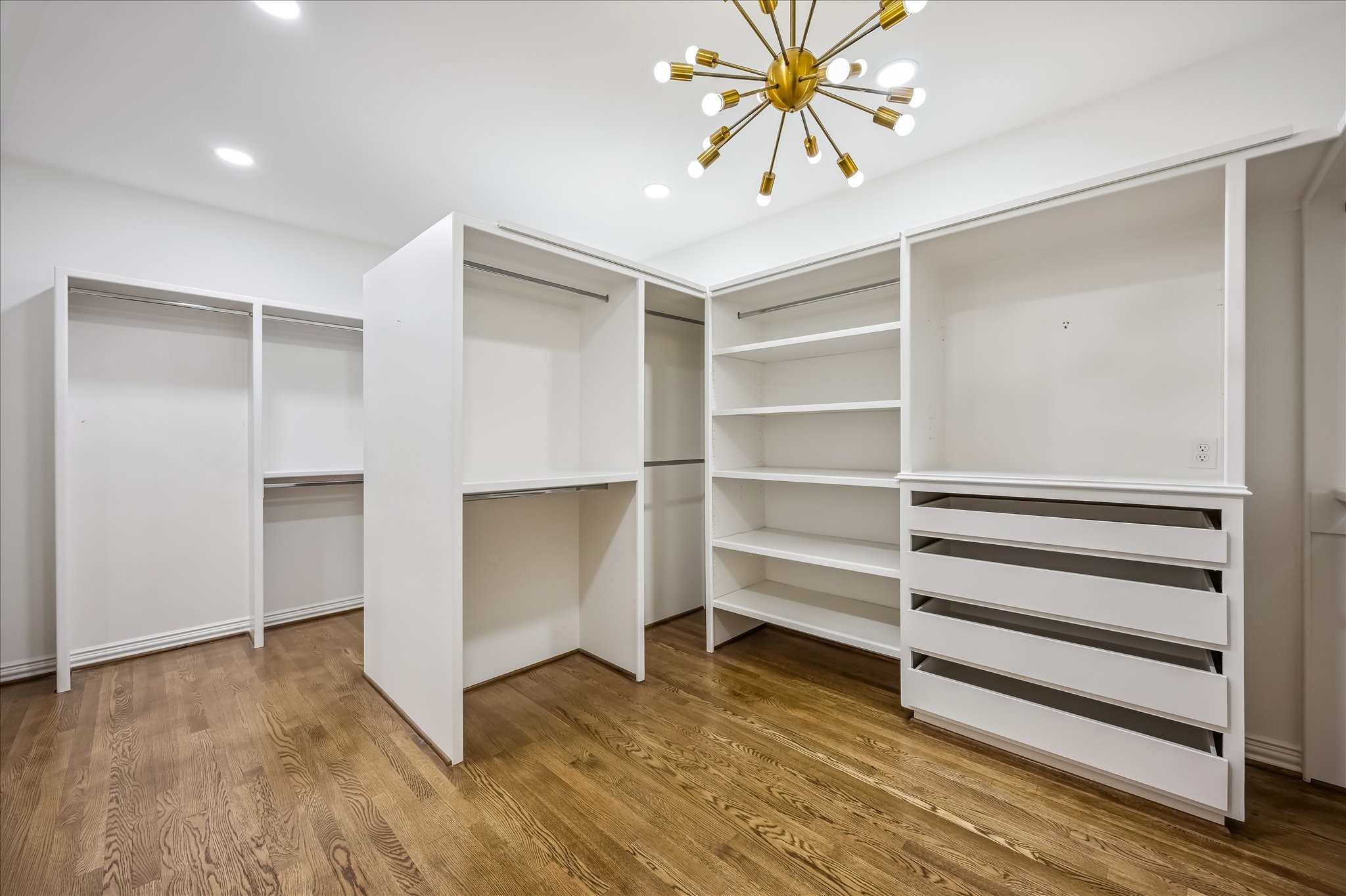 5034 Tangle Lane Houston, TX 77056 - Photo 25 of 50 The primary suite includes two separate, generously scaled dressing rooms, each extensively customized with built-in wardrobe storage to provide exceptional organization without sacrificing the clean, tailored appearance of the space.