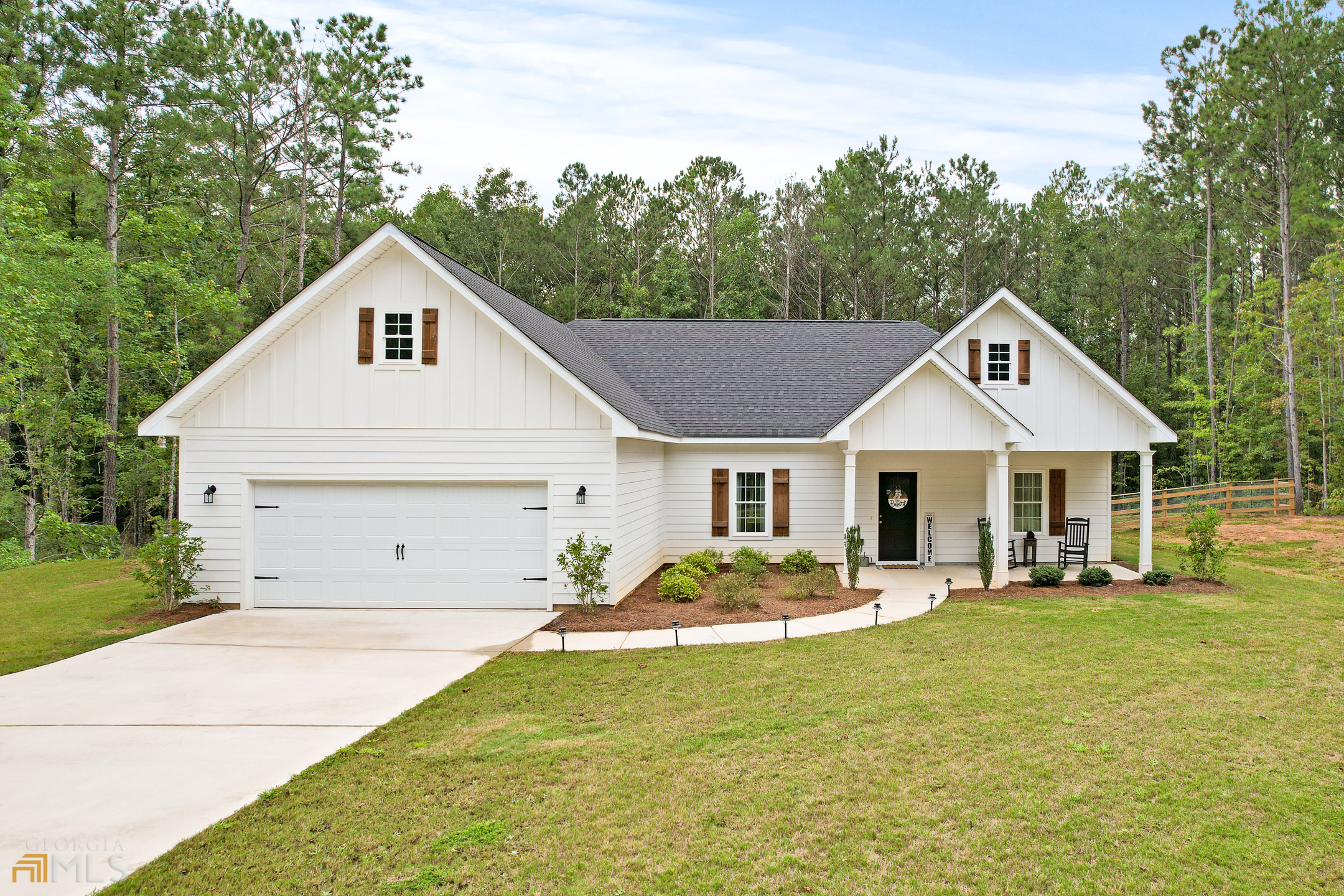 193 Five Points Road Milner, GA 30257 - Photo 1 of 1 a front view of a house with garden