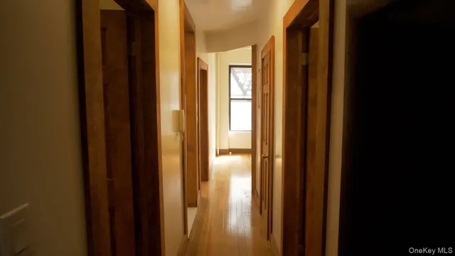 a view of an empty room with a window