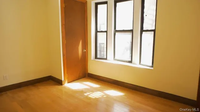 a view of an empty room and window