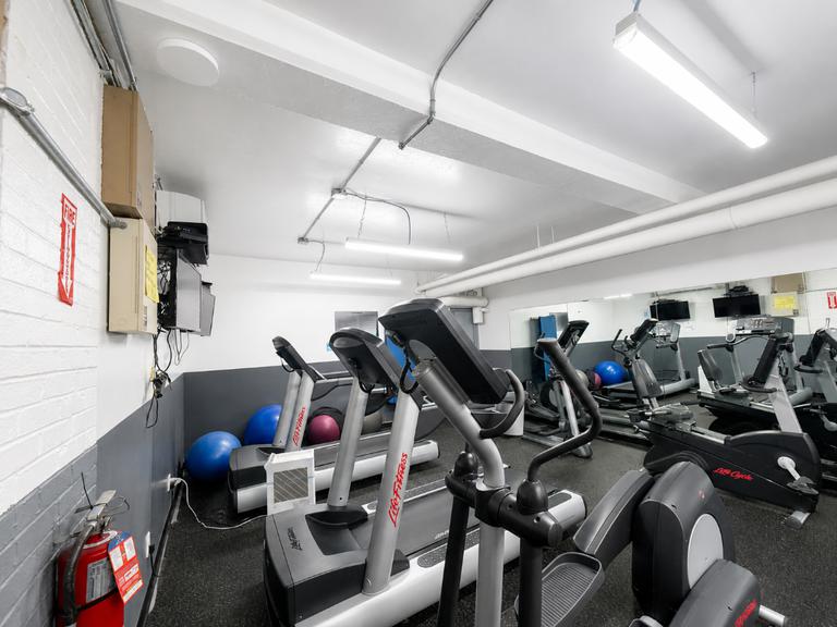 425 Riverside Drive, Unit 6D Manhattan, NY 10025 - Photo 12 of 14 a view of a room with gym equipment