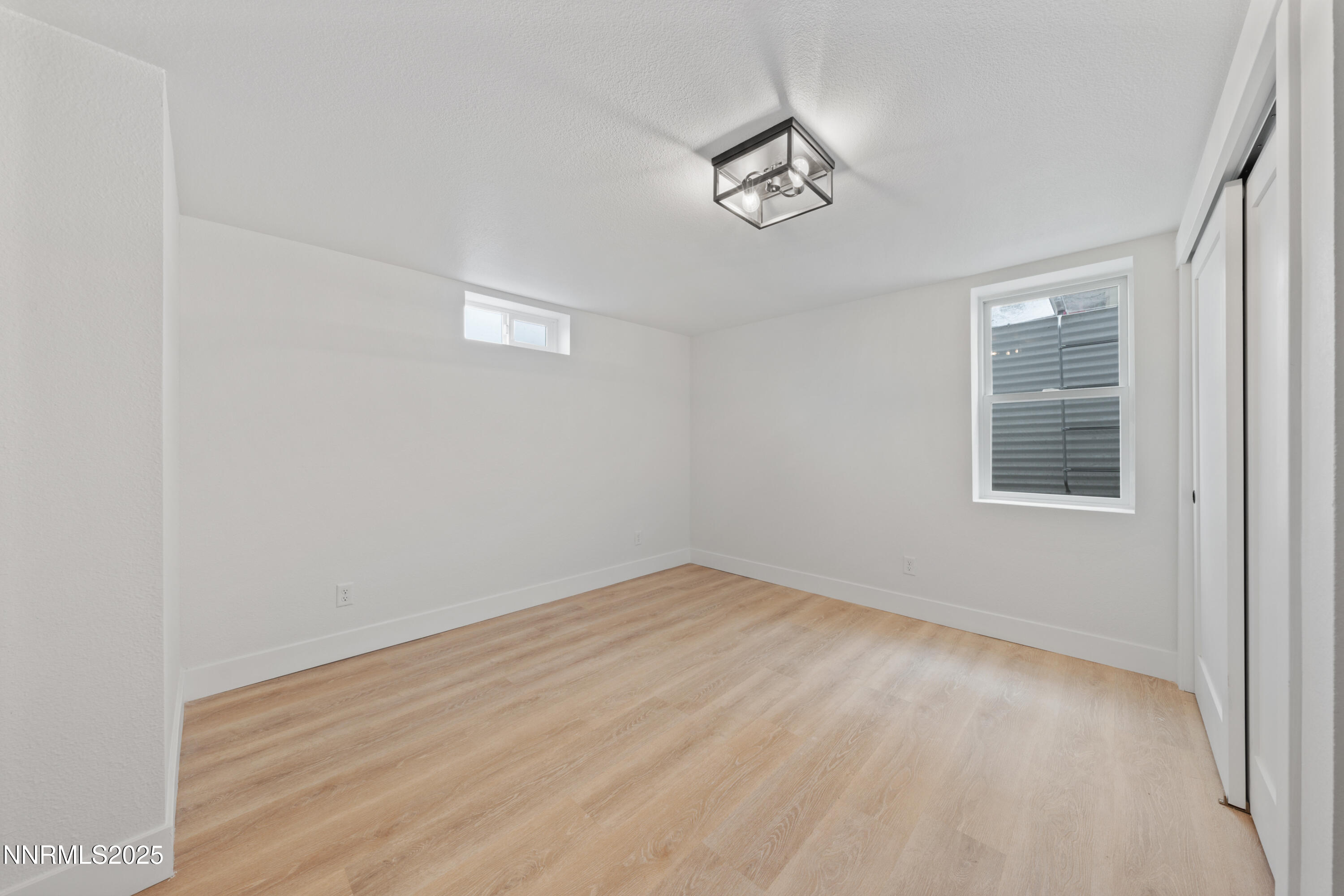 625 Hunter Lake Drive Reno, NV 89509 - Photo 28 of 65 wooden floor in an empty room with a window
