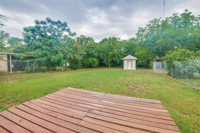 a view of a backyard with wooden floor