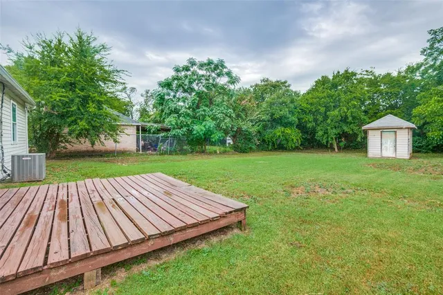 a view of a backyard with sitting area