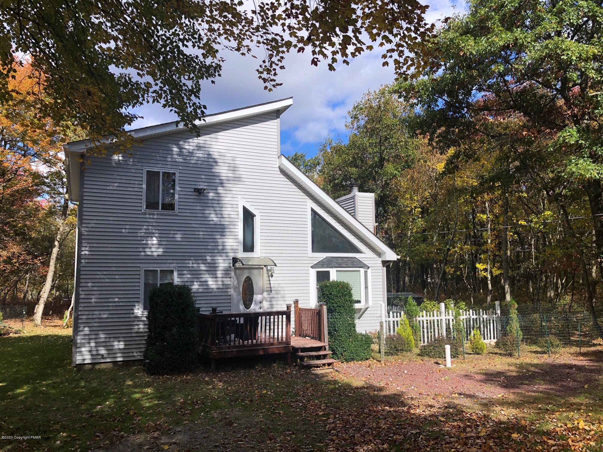 223 Sage Road Long Pond, PA 18334 - Photo 2 of 28 a front view of a house with a garden