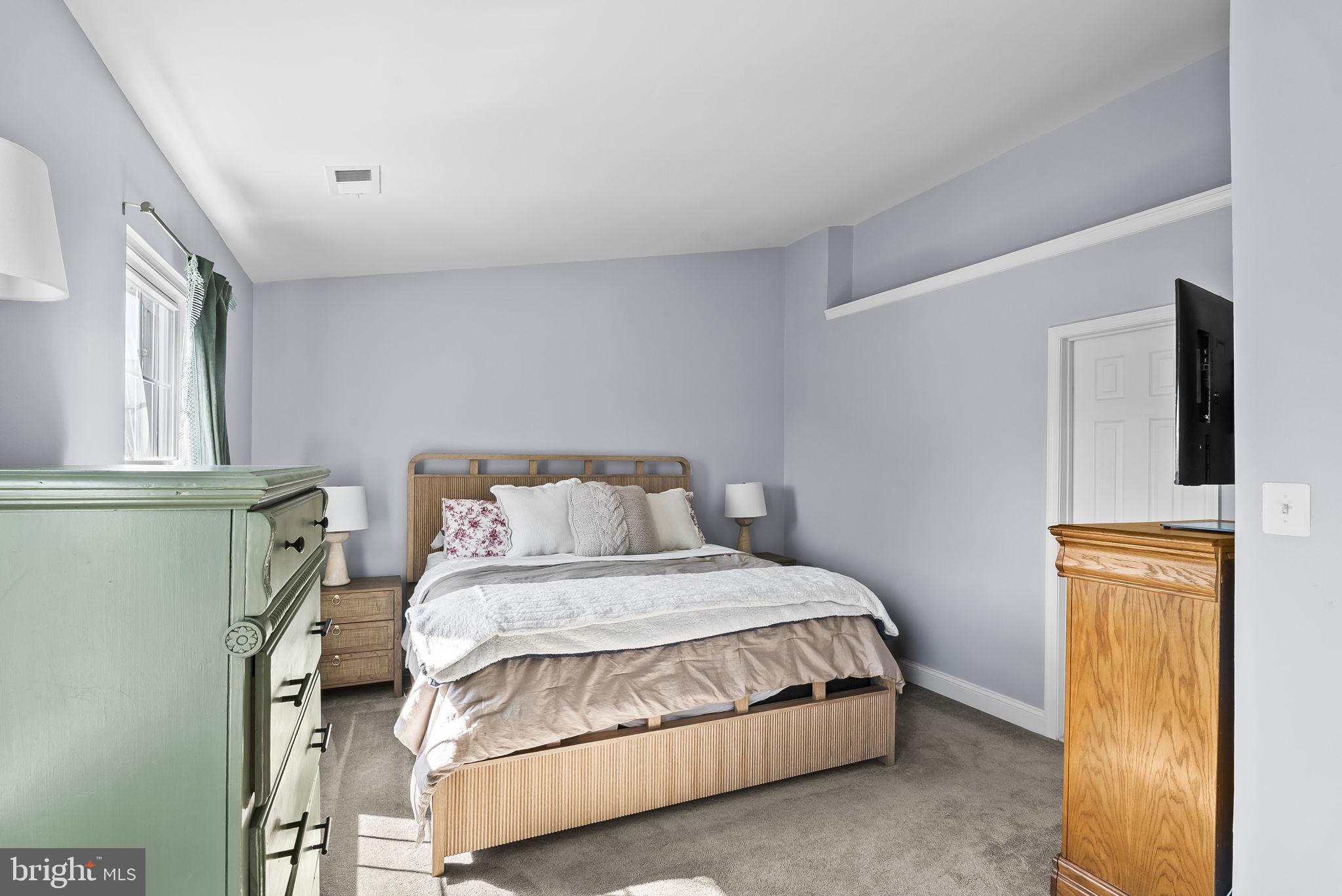 25 Hunters Gate Court Silver Spring, MD 20904 - Photo 16 of 32 a bedroom with a bed and window