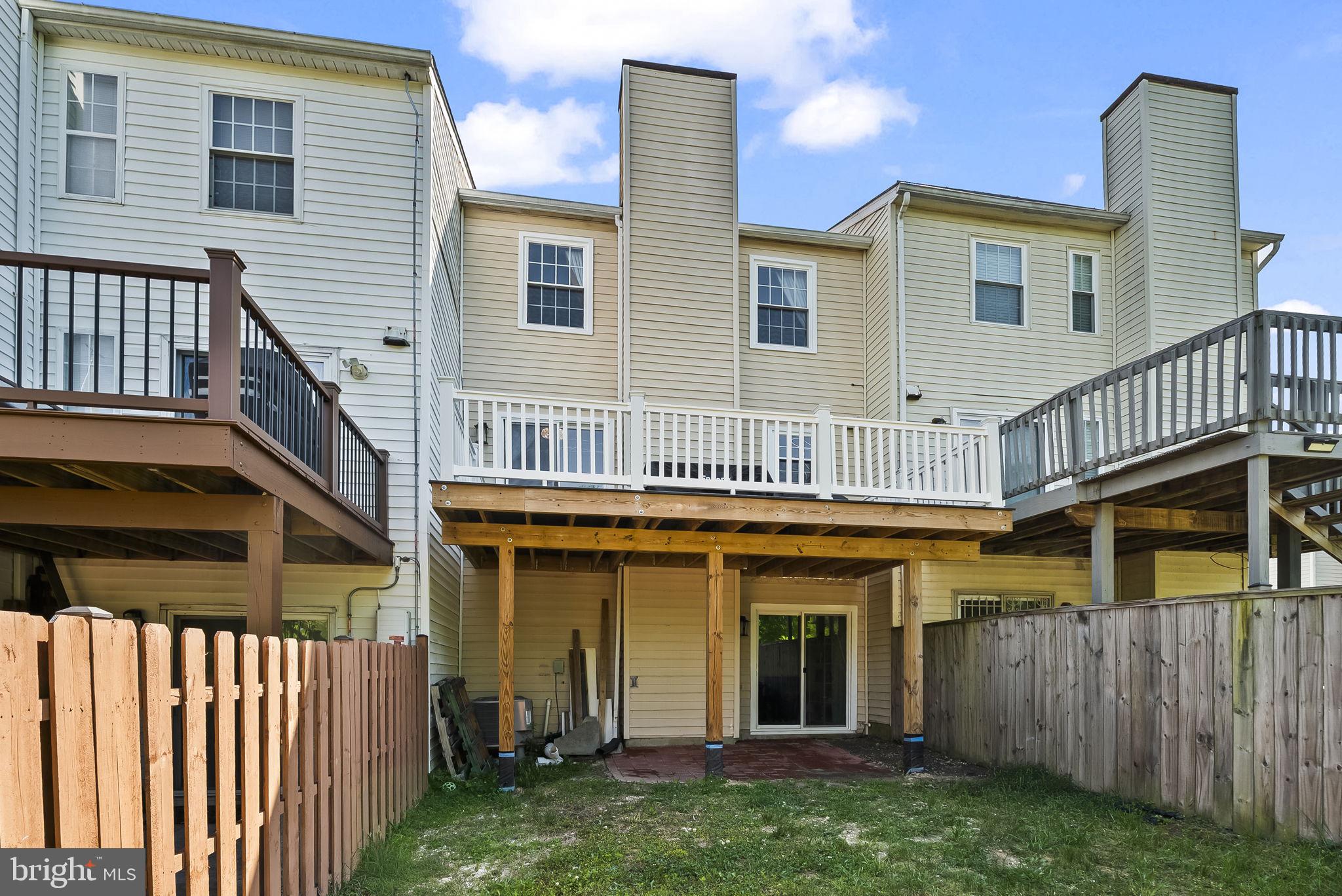 25 Hunters Gate Court Silver Spring, MD 20904 - Photo 31 of 32 a view of a house with wooden deck and furniture