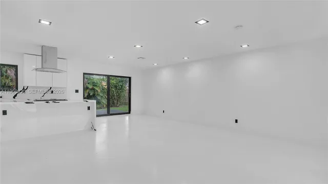 a view of a kitchen with a sink and a window