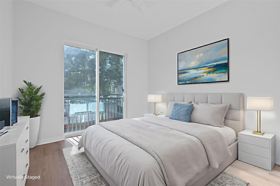 1900 Barton Springs Road, Unit 2019 Austin, TX 78704 - Photo 11 of 30 a bedroom with bed and large window