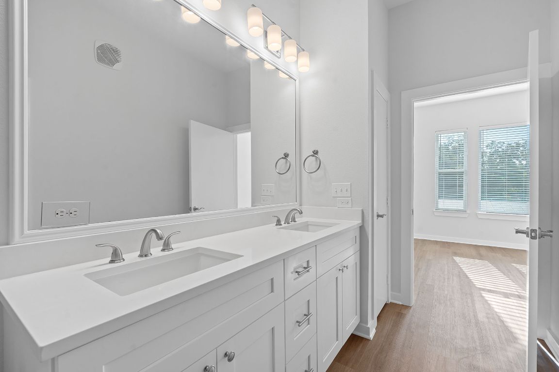 1900 Barton Springs Road, Unit 2019 Austin, TX 78704 - Photo 13 of 30 a bathroom with a sink double vanity and a mirror