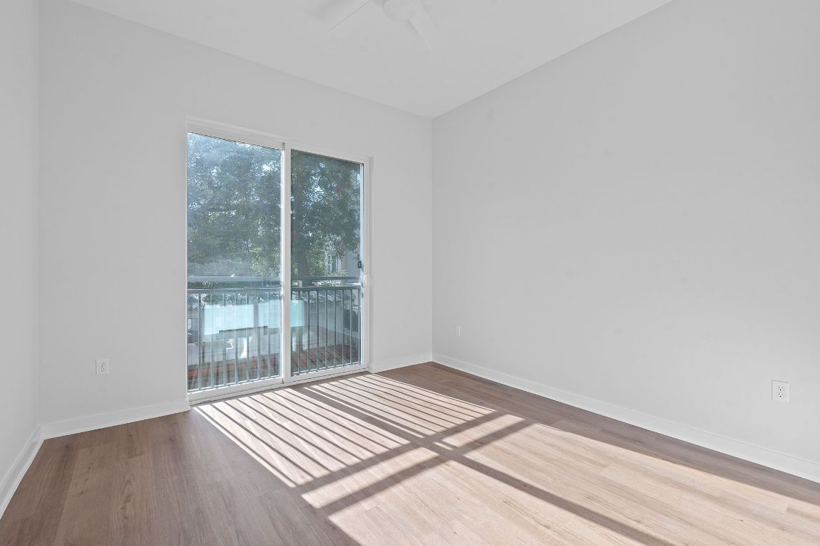 1900 Barton Springs Road, Unit 2019 Austin, TX 78704 - Photo 14 of 30 a view of wooden floor in an empty room