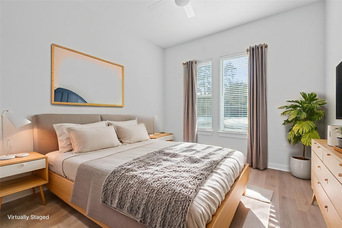 1900 Barton Springs Road, Unit 2019 Austin, TX 78704 - Photo 15 of 30 a bedroom with a bed and a large window