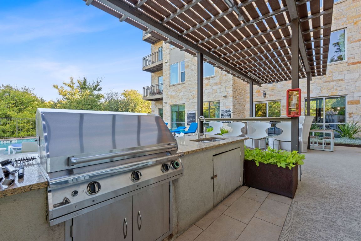 1900 Barton Springs Road, Unit 2019 Austin, TX 78704 - Photo 20 of 30 a kitchen with a stove and a sink