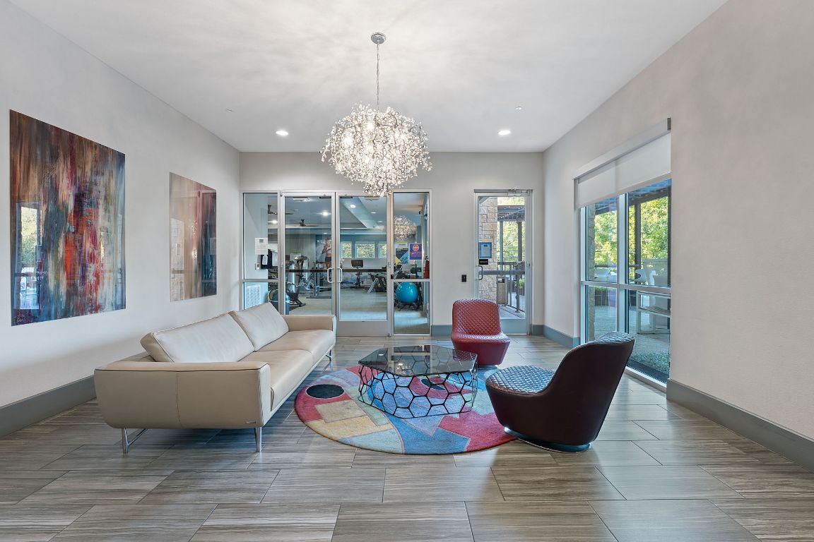 1900 Barton Springs Road, Unit 2019 Austin, TX 78704 - Photo 23 of 30 a living room with furniture and a chandelier
