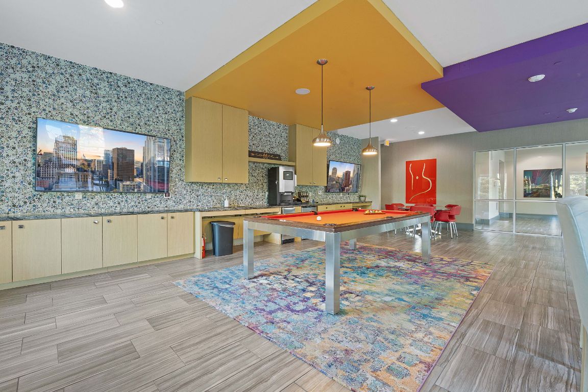 1900 Barton Springs Road, Unit 2019 Austin, TX 78704 - Photo 28 of 30 a kitchen with stainless steel appliances granite countertop a sink and cabinets